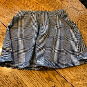 Black and white plaid with a hint of brown in the stripes.